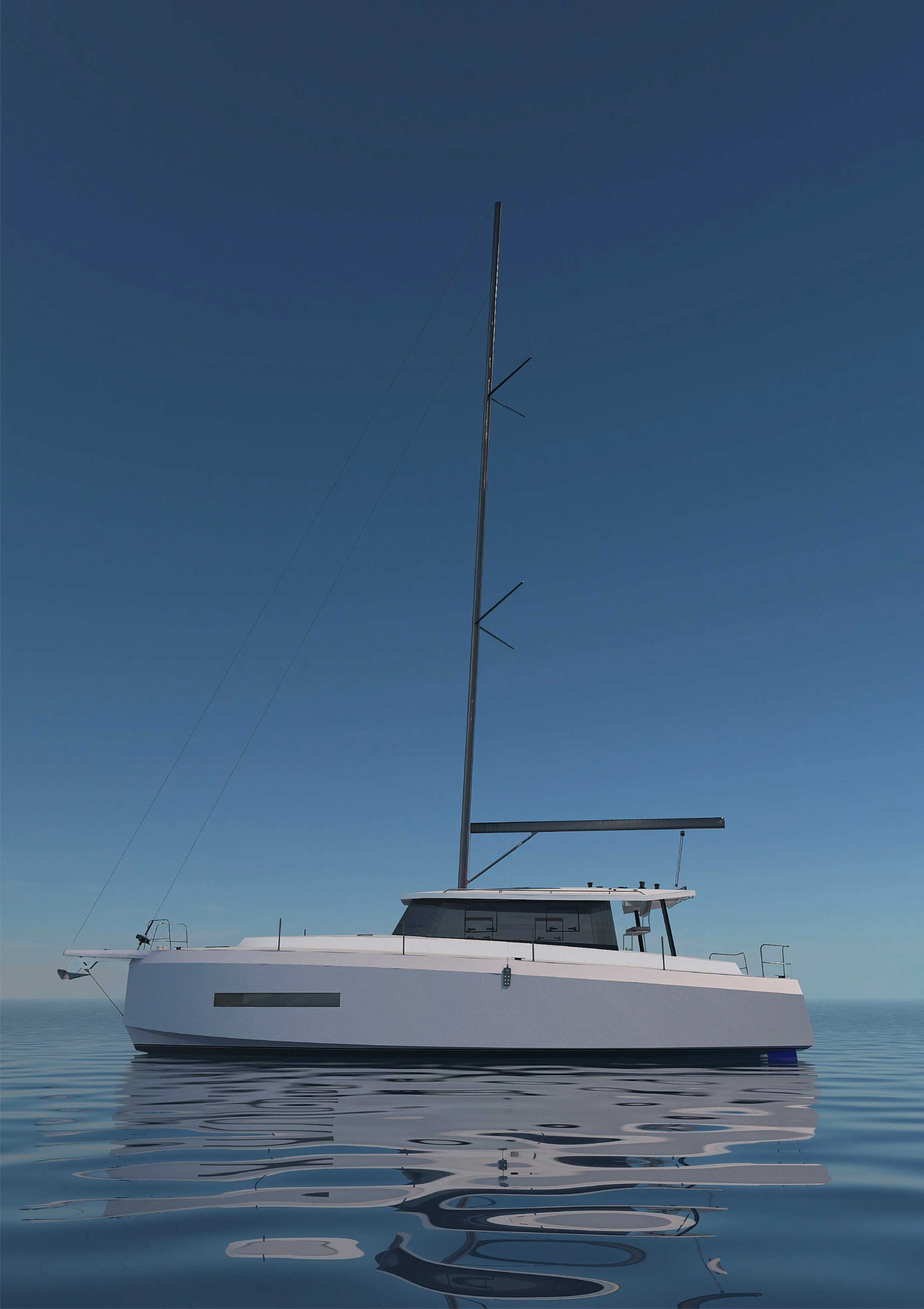 Vue du bateau de profil au mouiillage les voiles baissées.